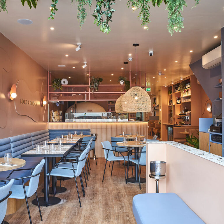 Dining room with blue leather banquettes at Bocca Bocca 