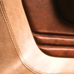 Close-up of stitched Saloon French Vanilla and Saloon Whiskey leather in a 1939 Chevrolet Sedan