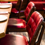 Close-up of Old English Burgundy leather dining chairs at Burger & Lobster, Bond Street 
