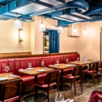 Dining room with Old English Burgundy leather banquettes at Burger & Lobster, Bond Street 
