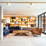 Residents’ lounge with Old English Bruciato leather armchairs at Chelsea Crescent 