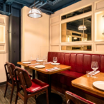 Corner table with an Old English Burgundy leather banquette at Burger & Lobster, Bond Street 