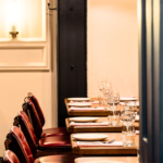 Row of Old English Burgundy leather dining chairs at Burger & Lobster, Bond Street 
