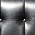 Close-up of black buttoned leather on a 1903 AC Sociable