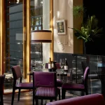 Shelly Wineberry leather dining chairs in the Wine Lounge at Delaire Graff Estate