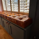 Buttoned Old English Malt leather window seat cushion
