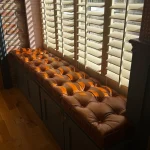 Buttoned Old English Malt leather window seat in a kitchen renovation in Scotland