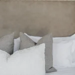 Close-up of a taupe leather headboard, Project Haasbroek